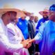 Chairman, ORIGIN Tech Group, Prince Samuel Joseph Samuel in a warm handshake with President Bola Tinubu during the formal launch of the large-scale Agro-mechanisation programme by the Governor of Niger State in Minna, Niger State while others watch with admiration.